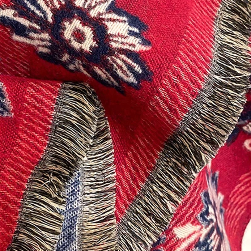 Tibetan scarf fringe tassel hem close-up showing mixed colored woven stripes, thick soft fabric texture and artisanal handcrafted details