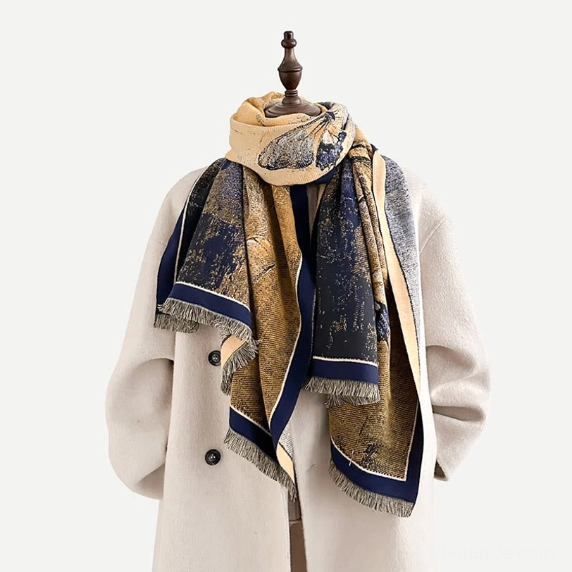 Person wearing Tibetan handwoven scarf with navy golden brown multicolor small print design