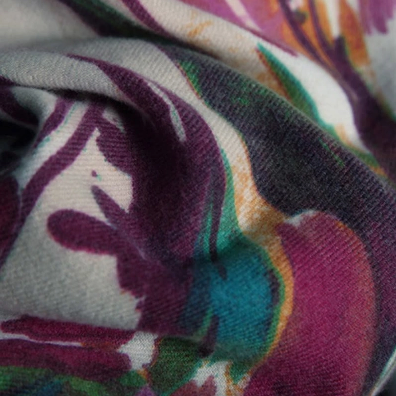 Tibetan shawl arranged display showing complete floral pattern coverage and artistic watercolor design