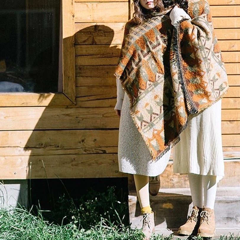 Tibetan fabric scarf showing intricate woven texture, repeating tribal patterns and authentic ethnic design elements