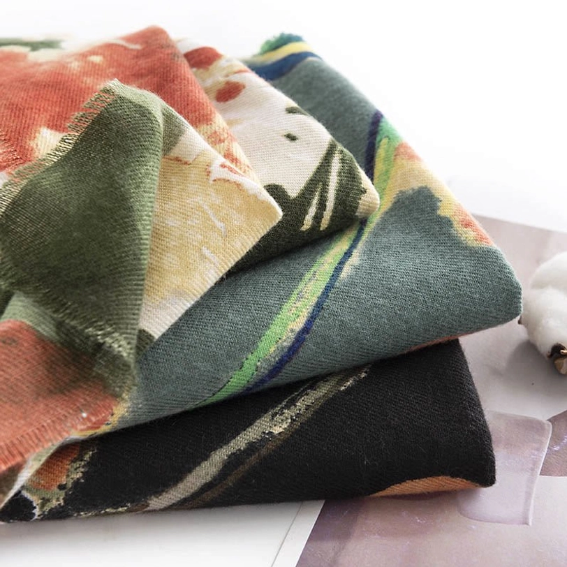 Tibetan ink printed scarf lifestyle shot showing versatile wear as warm wrap with cultural artistic design