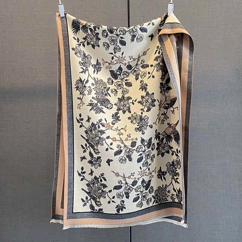 Monochrome Tibetan scarf with black floral and bird prints on beige base flat hanging display