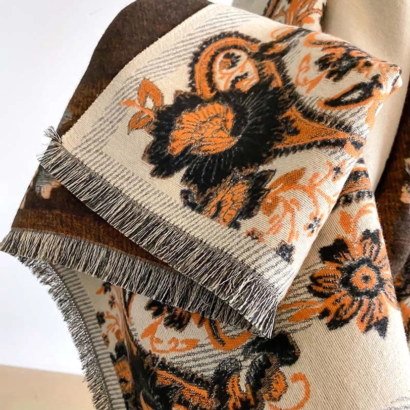 Tibetan scarf with multicolor paisley floral motifs on neutral base, mannequin display showing authentic handwoven styling and draped elegance