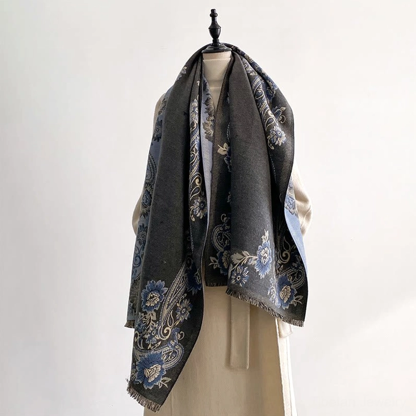 Tibetan handwoven reversible scarf with intricate paisley floral motifs, studio background display showcasing color depth and fabric drape