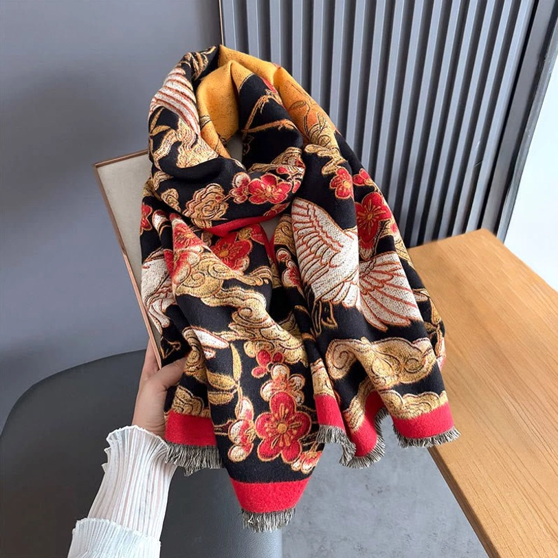 Reversible Tibetan scarf with frayed tassel hem, displaying intricate oriental woven patterns held by hand