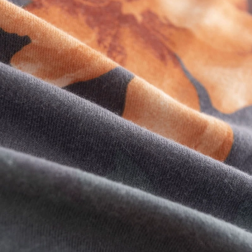 Detailed side view of Tibetan scarf fabric showing twill woven texture and matte finish hibiscus print