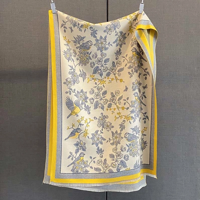 Tibetan scarf shawl featuring yellow birds and blue floral patterns on beige base with yellow grey trim