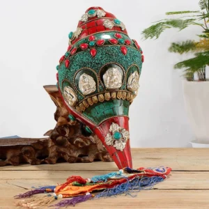 Tibetan handmade Shankha conch shell Buddhist decoration with turquoise and gemstone inlay on wooden display table