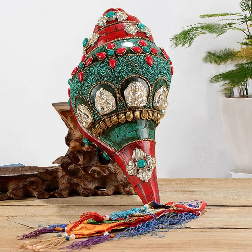 Tibetan handmade Shankha conch shell Buddhist decoration with turquoise and gemstone inlay on wooden display table