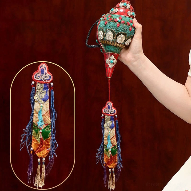 Hand-carved Tibetan Shankha conch shell with multi-color gemstone inlay and Buddhist symbols