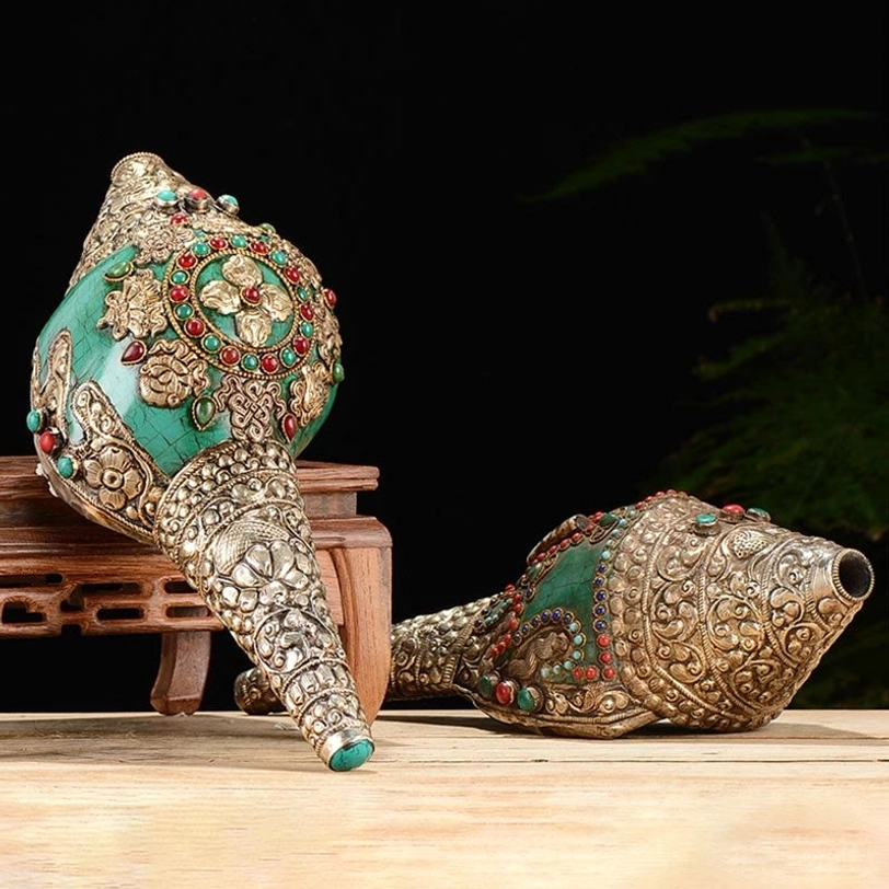 Tibetan handcrafted shankha conch shell with double dorje and turquoise inlay displayed on wooden stand, frontal and side view showing silver filigree details