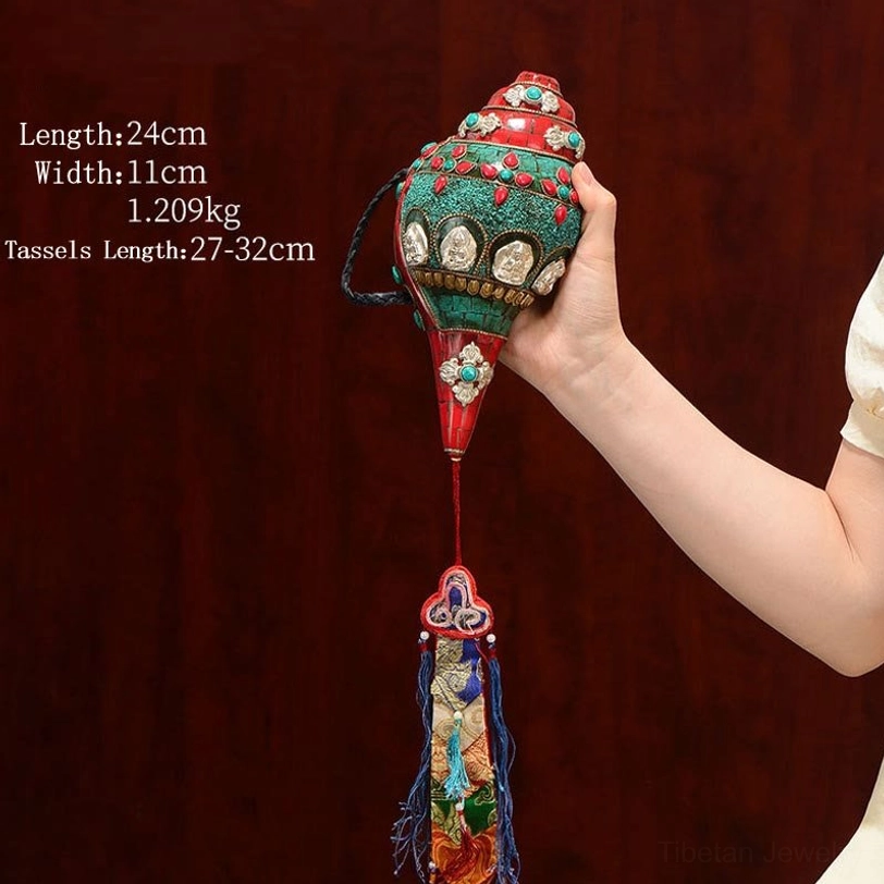 Front view of Tibetan Shankha conch shell with turquoise and colorful tassel hanging decoration