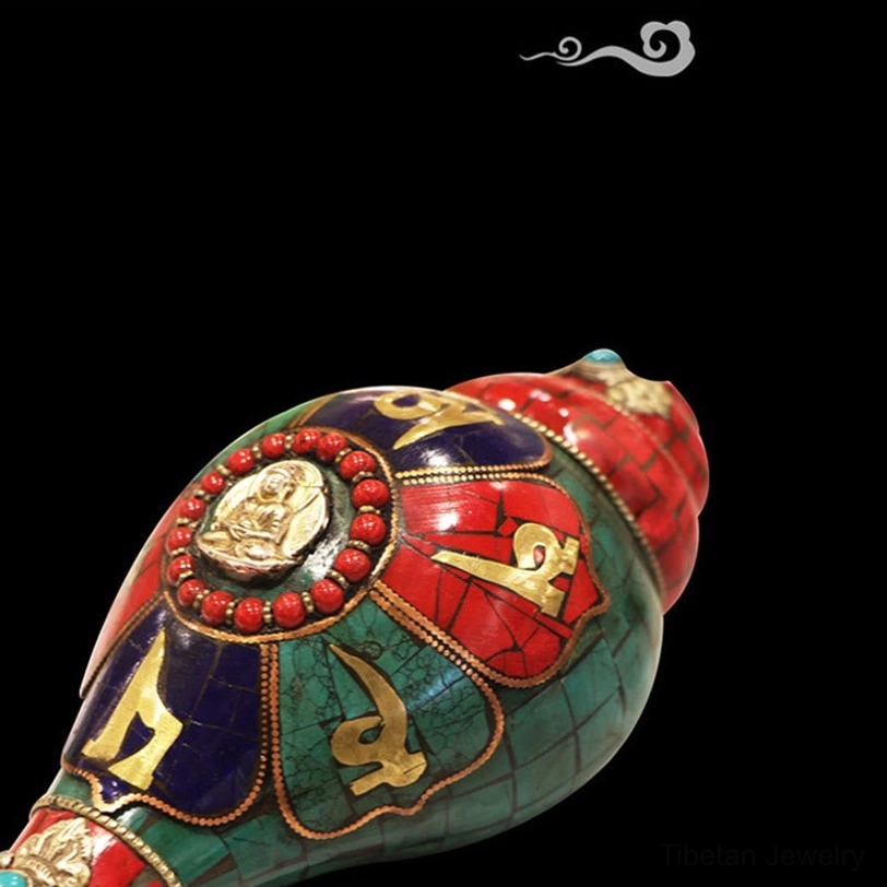 Low oblique Tibetan shankha conch with Buddha medallion, turquoise gemstones and decorative hanging strap