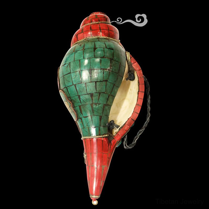 Rear bottom view of handcrafted Tibetan shankha showing inner conch cavity and red tapered tip