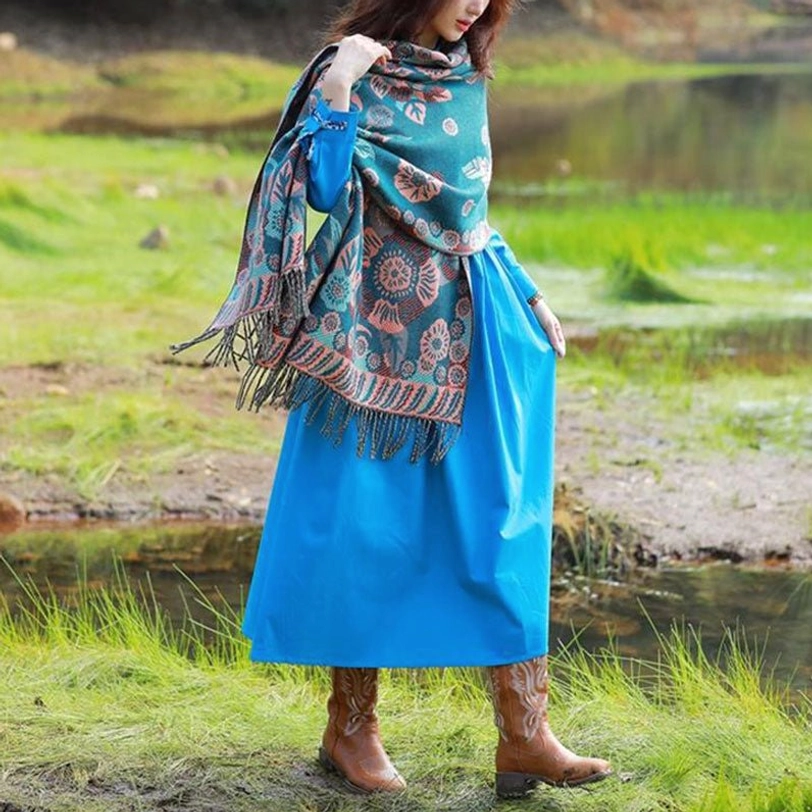 Casual full-body styling of Tibetan floral cashmere shawl with tassel hem