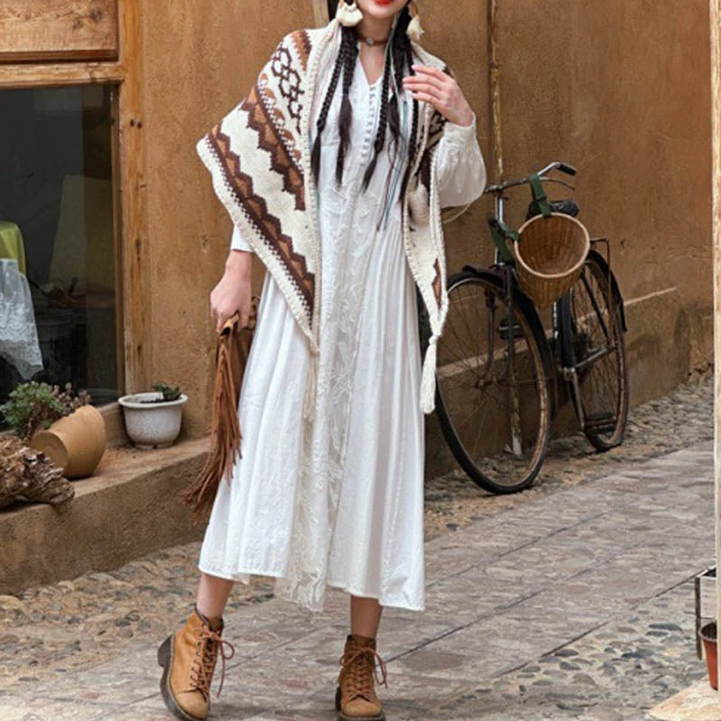 Tibetan geometric knit tassel shawl close-up, brown and beige striped pattern with handcrafted fringe details