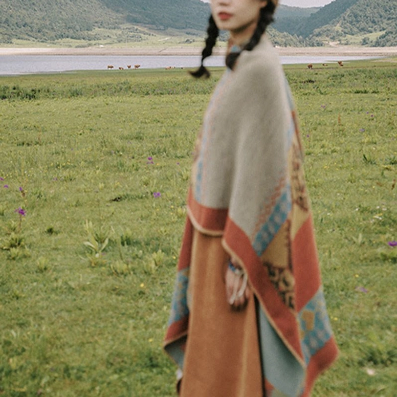 Tibetan diamond pattern shawl texture detail showcasing intricate ethnic weave and color variation in warm earth tones