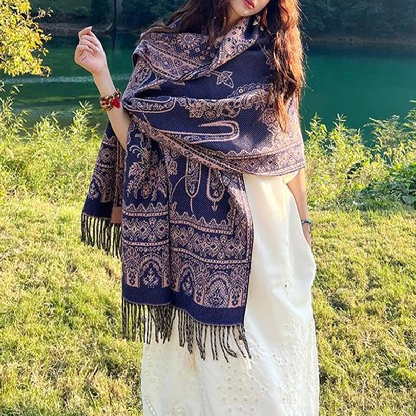 Tibetan shawl draped elegantly showing reversible side and botanical pattern details