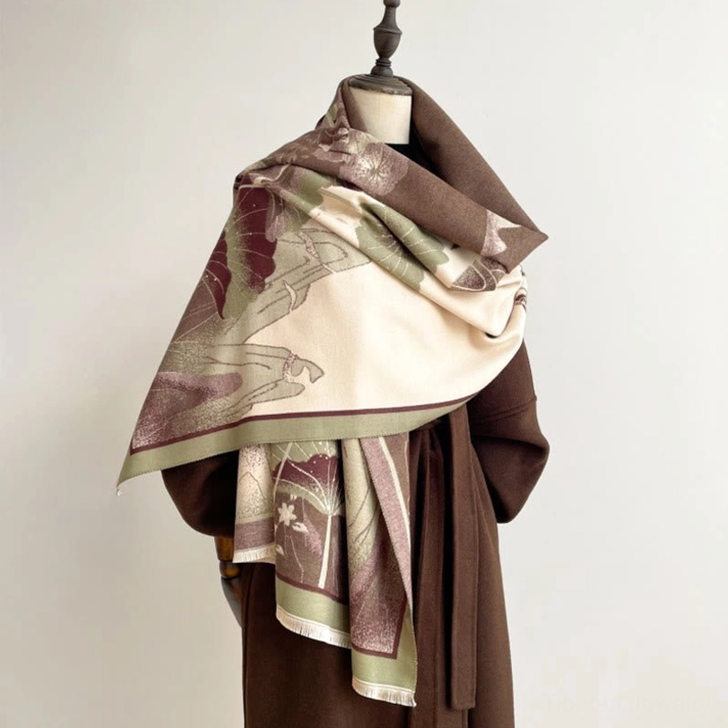 Artisan Tibetan lotus shawl in earthy retro tones with mountain landscape print, three-quarter draped on mannequin with brown coat