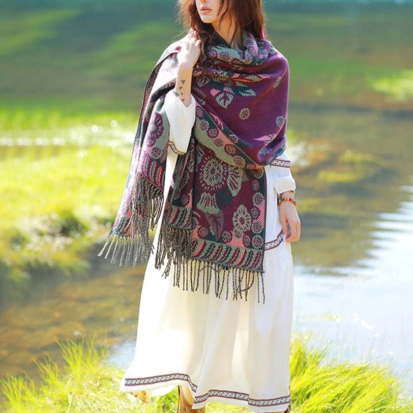 Tibetan floral wrap worn over evening gown for sophisticated styling