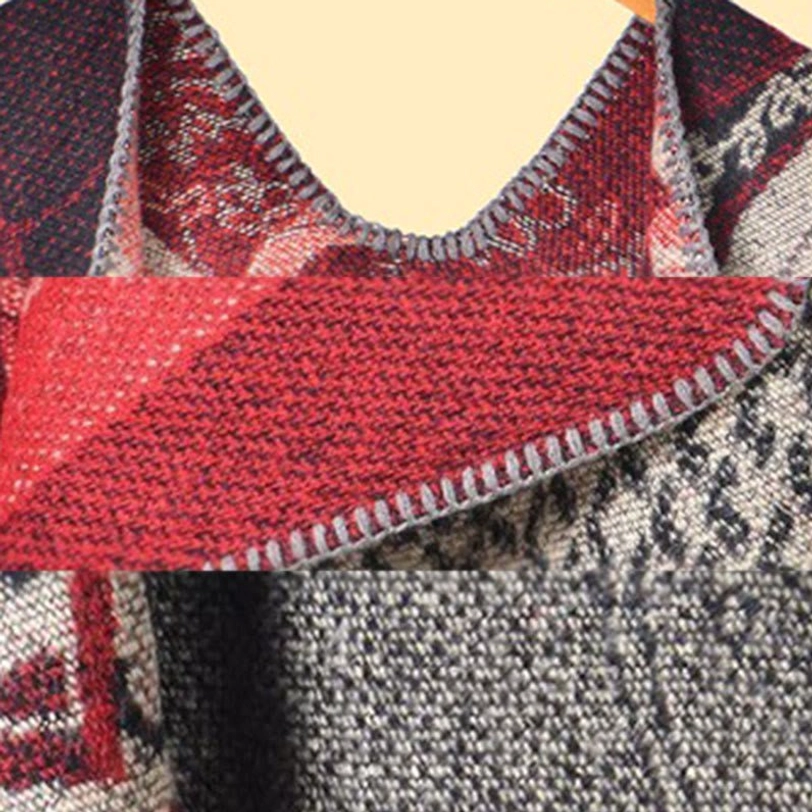 Tibetan jacquard shawl fabric close-up showing knit texture blanket stitch edge and reversible red-grey material