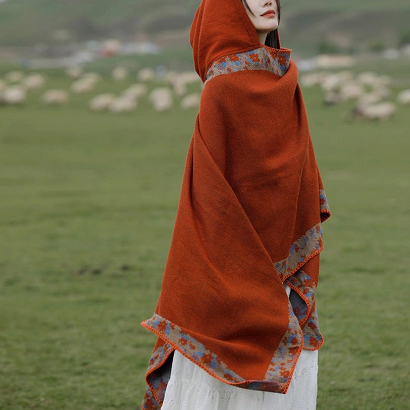 Tibetan floral trim shawl back view showing intricate border details and soft fabric texture on grassland