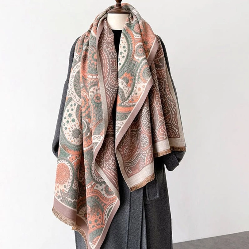 Tibetan paisley shawl detail view showing quality of tassel fringe, multi-tone border trim, and traditional woven craftsmanship