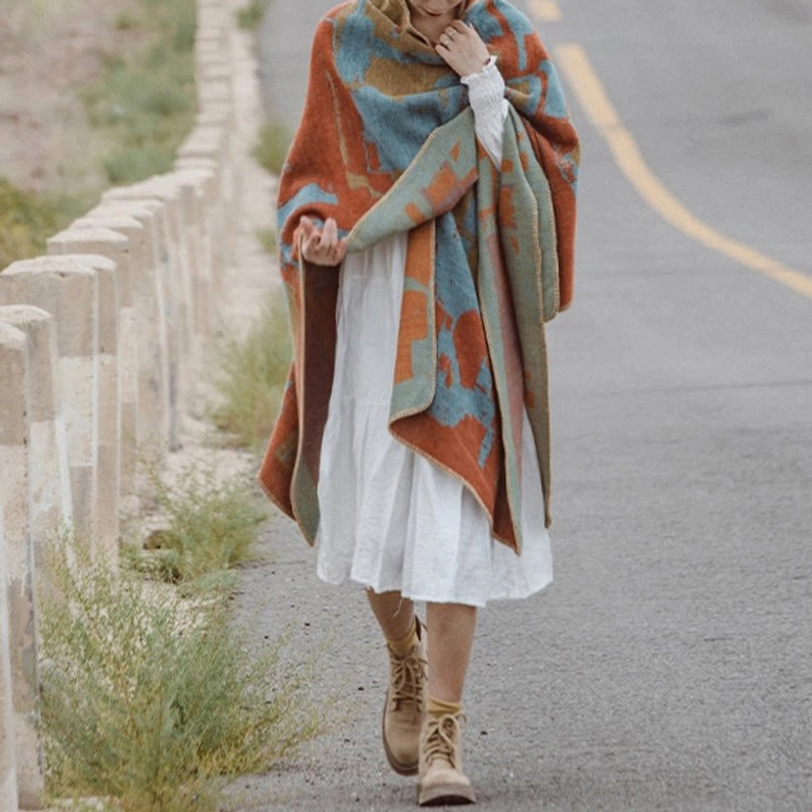 Bohemian Tibetan cape shawl front walking shot with jacquard geometric design