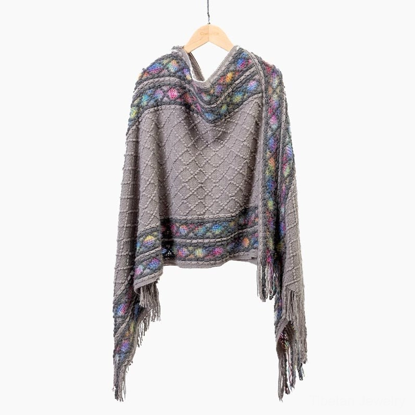 Gray Tibetan rhombus knit tassel shawl with ethnic border showing neutral color versatility