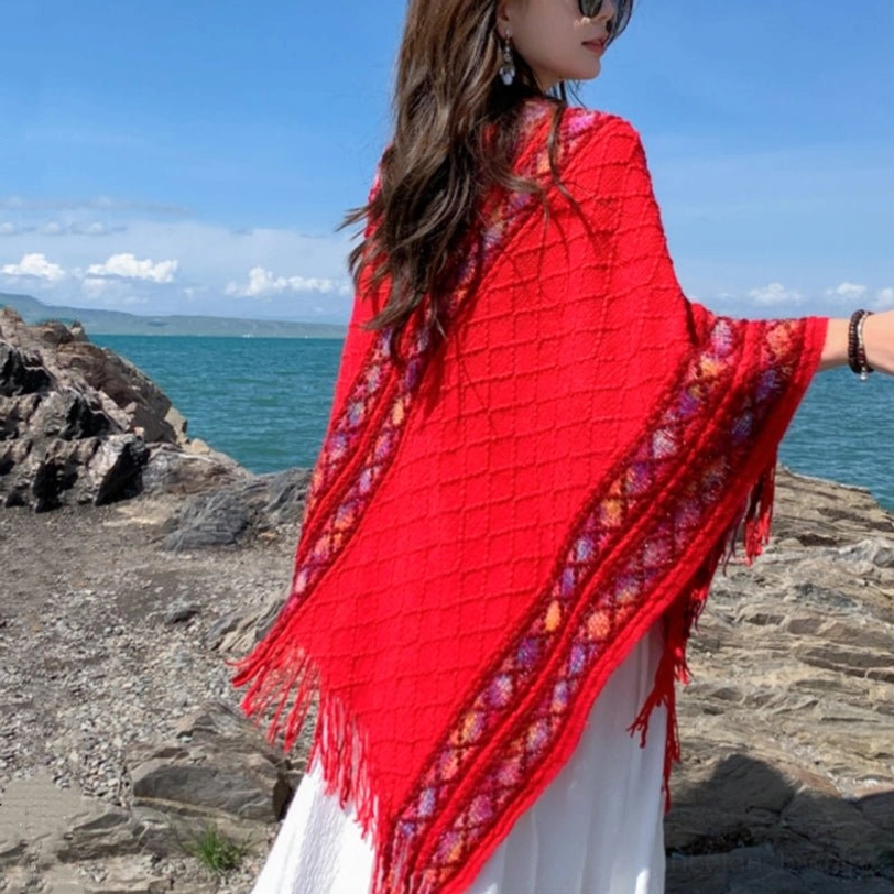 Gray Tibetan ethnic shawl with traditional rhombus weave and vibrant tribal trim on neutral base
