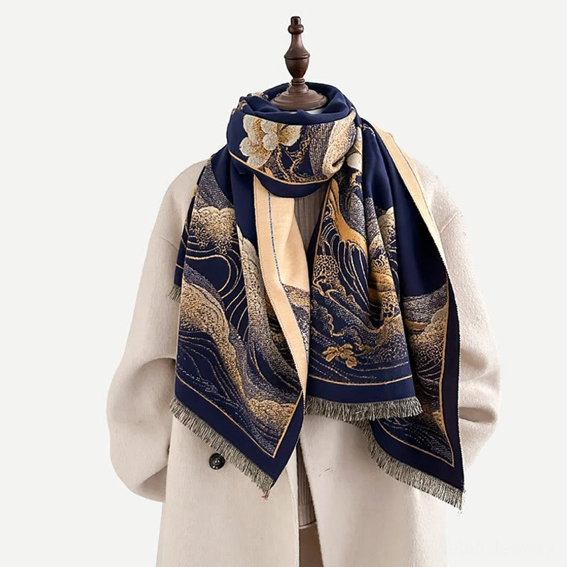 Artisanal Tibetan shawl featuring lotus and ocean wave motifs with hand-tied tassel hem