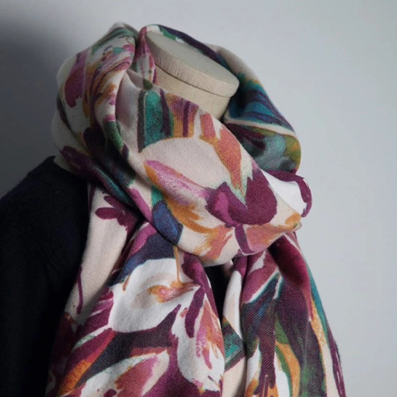 Knotted Tibetan floral wrap on mannequin showing soft folded fabric texture and elegant draping technique