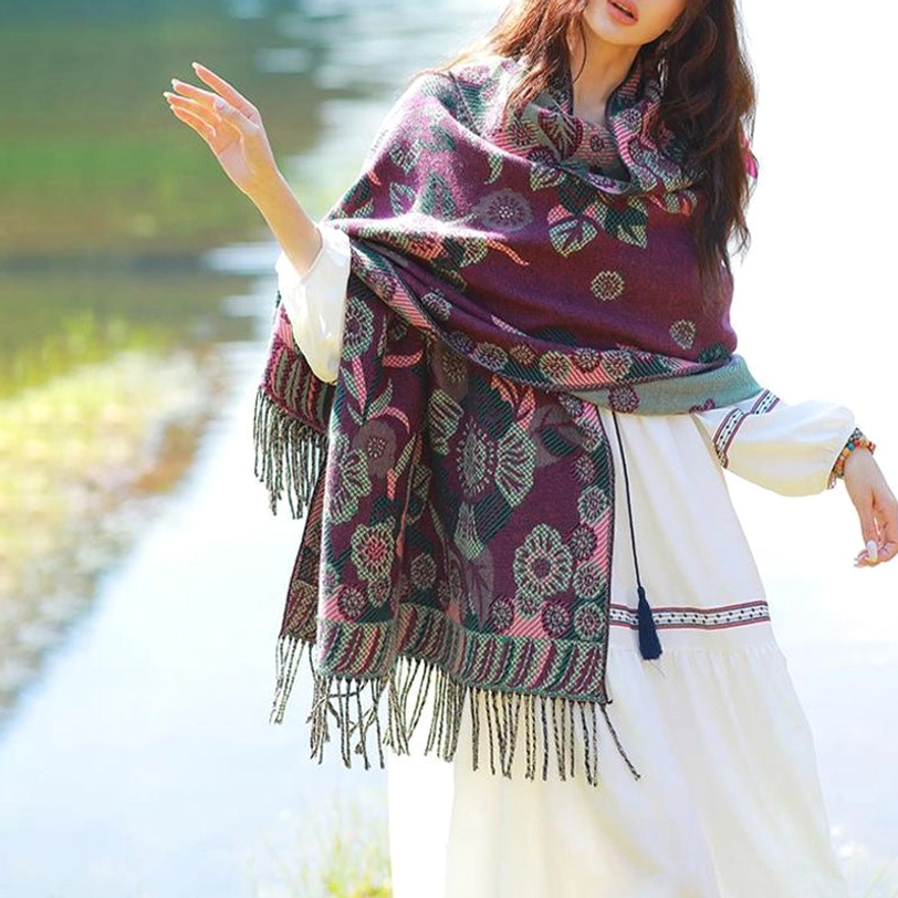Tibetan botanical wrap layered over coat for elegant everyday styling