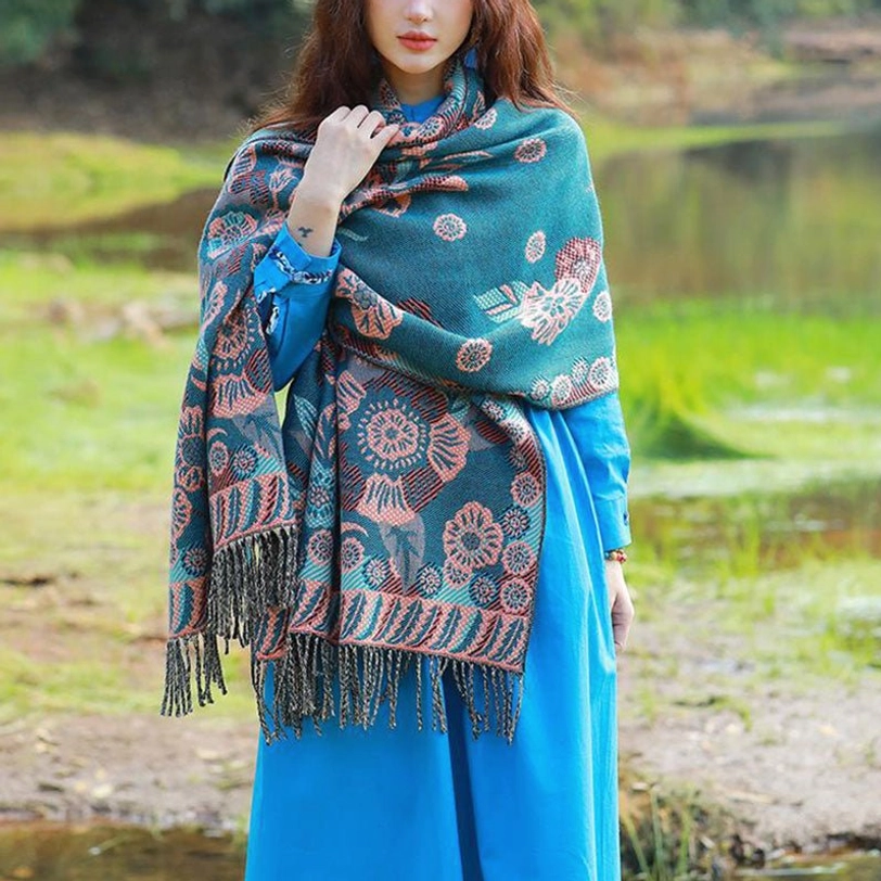Tibetan floral cashmere wrap worn as cozy neck warmer with detailed patterns