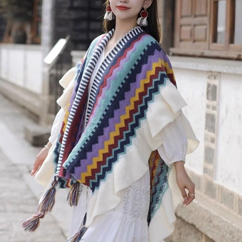 Side view of model in Tibetan shawl with ethnic striped pattern, ruffled flounce and decorative hem tassels at ancient town