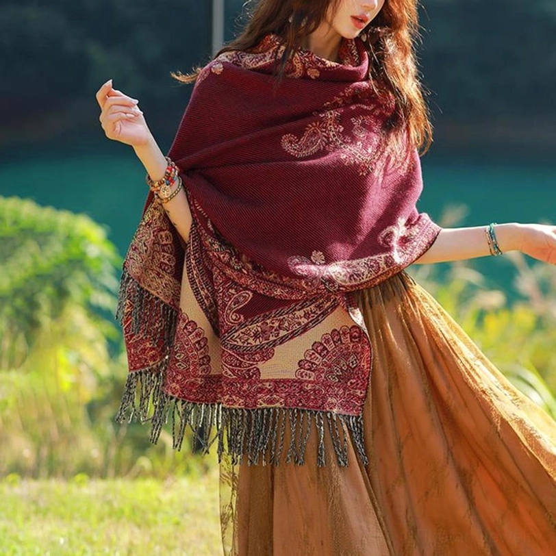 Tibetan vine leaf travel shawl side view worn with tan tone skirt and fringe details