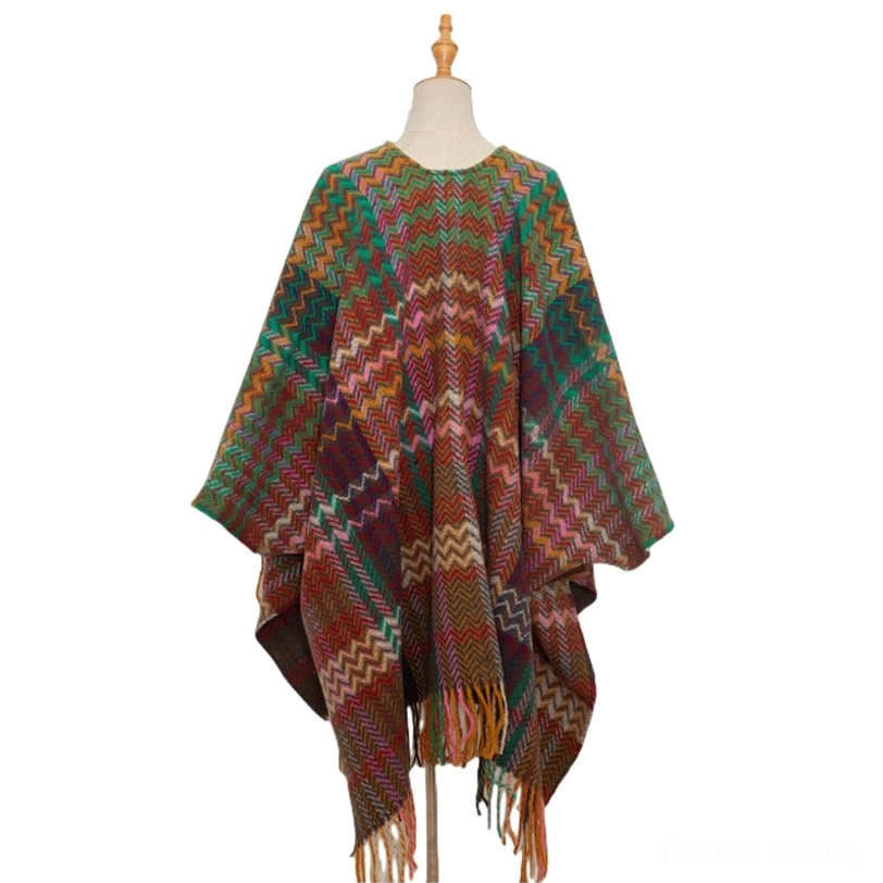 Tibetan shawl with tassel fringe draped as cozy home throw blanket