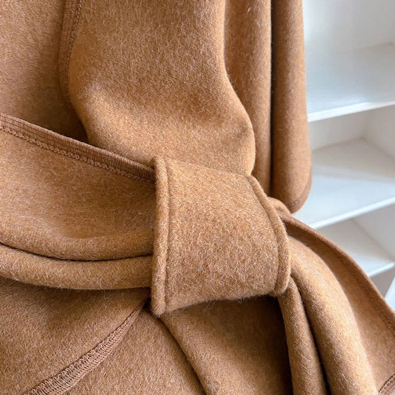 Tibetan shawl tie and fabric close-up - camel brown, thick plush texture, neat tied knot trim, handmade detail
