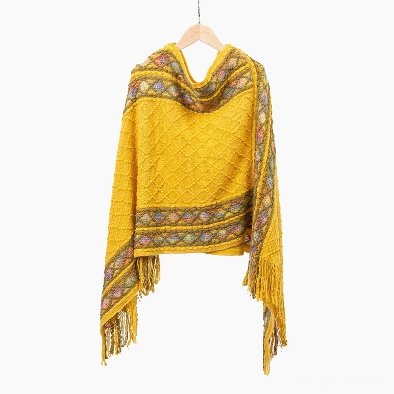Tibetan poncho shawl worn as travel blanket and cozy wrap for outdoor adventures and festivals