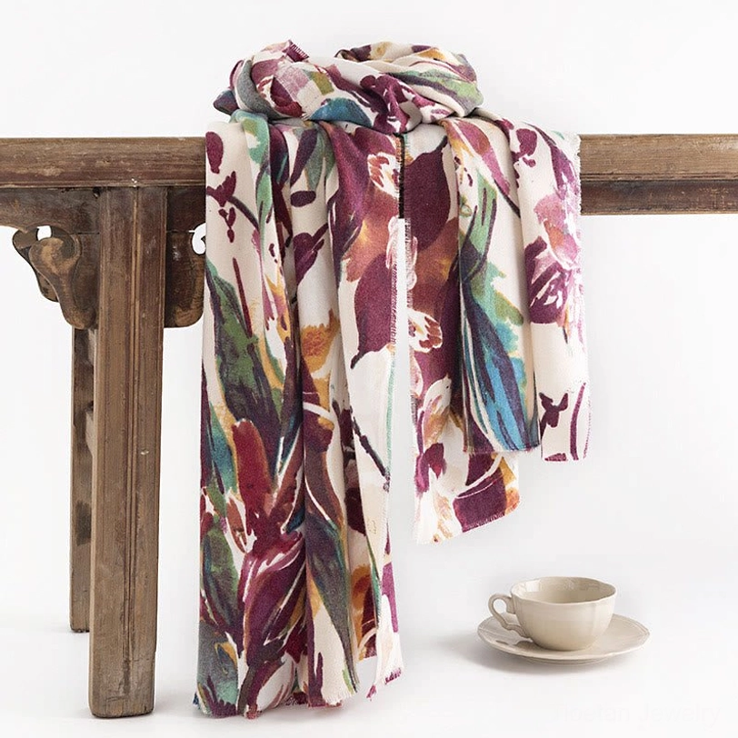 Tibetan floral shawl hung on wooden vintage rack, showcasing watercolor flower print and natural drape