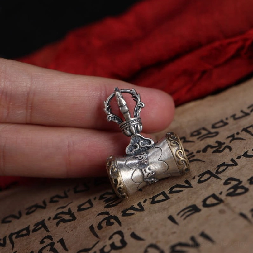 Tibetan silver dorje bell pendant featuring five-prong vajra top with protective spiritual symbolism