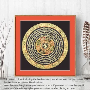 Framed sacred mandala thangka painting featuring Tibetan six-character mantra with intricate gold circular patterns and decorative border