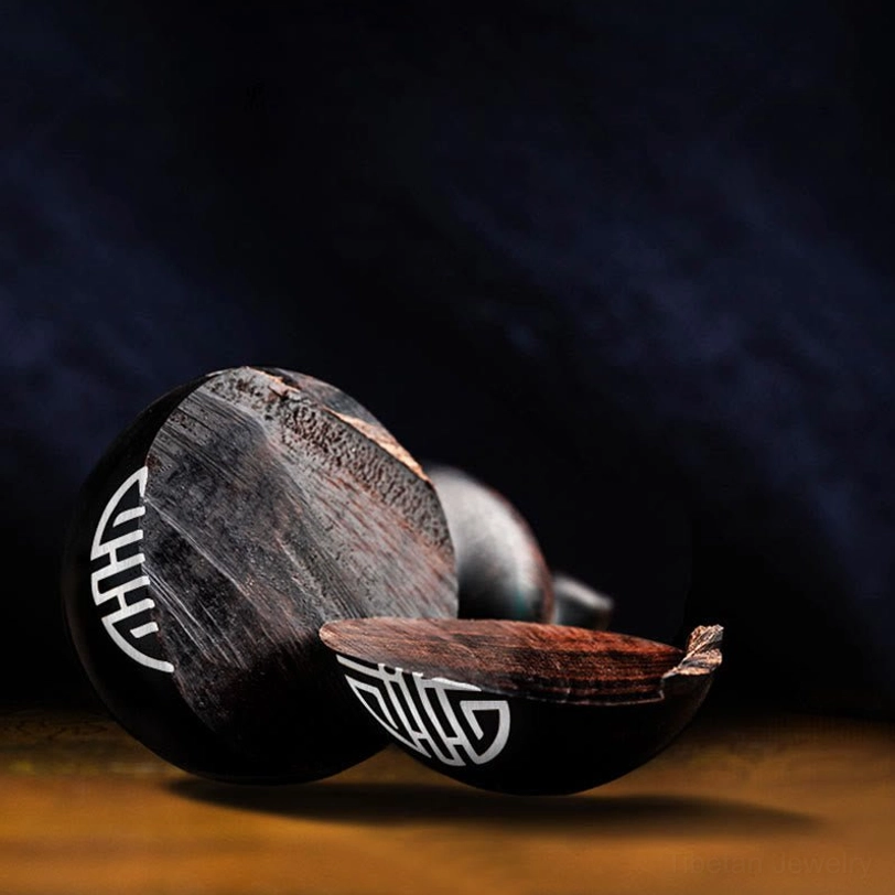 Tibetan spiritual gourd keychain with traditional sacred symbols carved into ebony or red sandalwood, daily meditation and protection practice tool