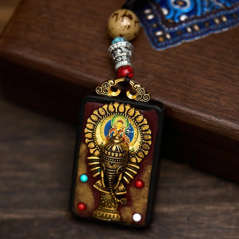 Tibetan spiritual necklace featuring Ganesha obstacle remover symbol on ebony wood