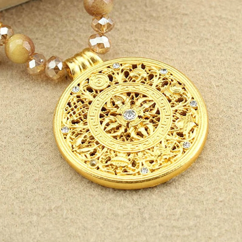 Tibetan spiritual necklace featuring enlightenment lotus symbol and protective tiger eye energy