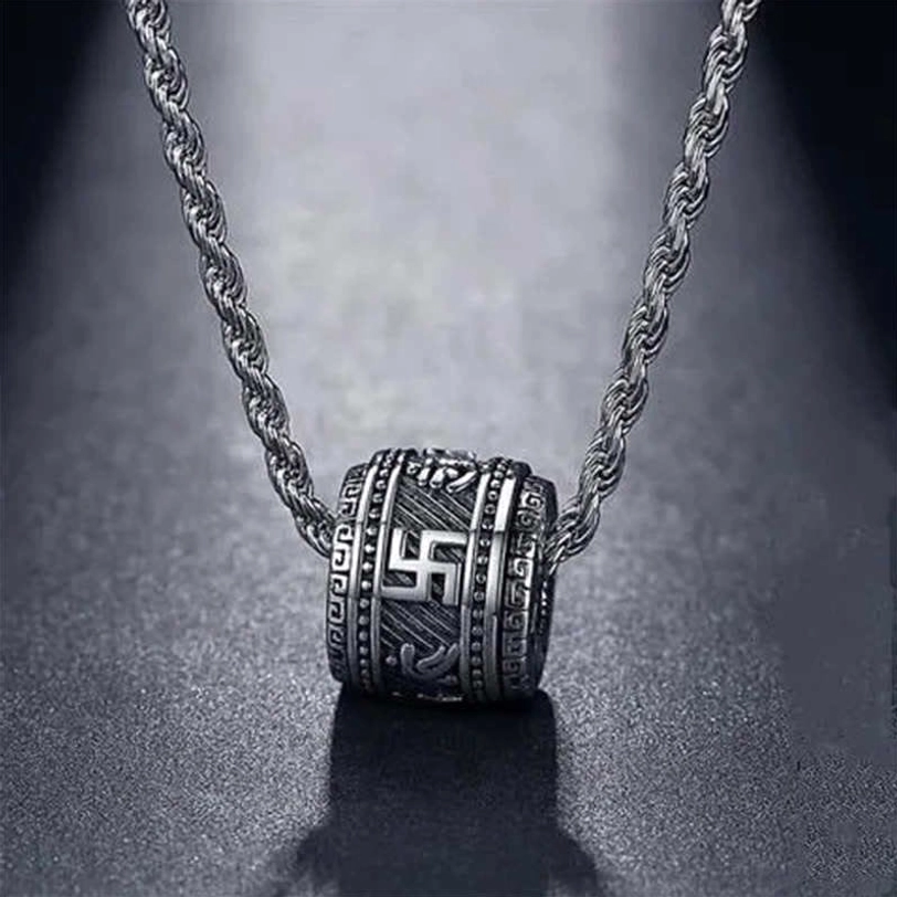 Tibetan mantra pendant necklace featuring engraved swastika and Buddhist symbols on vintage silver-toned barrel with twisted rope