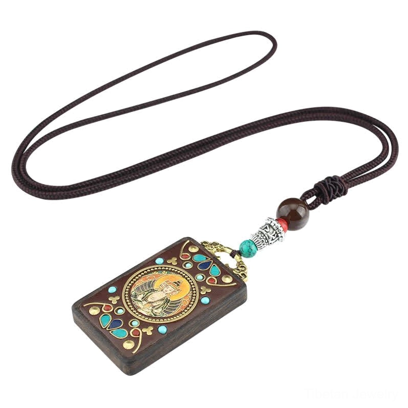 Tibetan thangka pendant necklace with metal accents and traditional deity iconography for spiritual practice