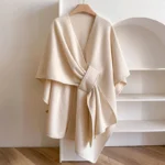 Tibetan split shawl wrap in beige - front view with tied knot detail, soft fuzzy wool-like fabric, oversized drape fit