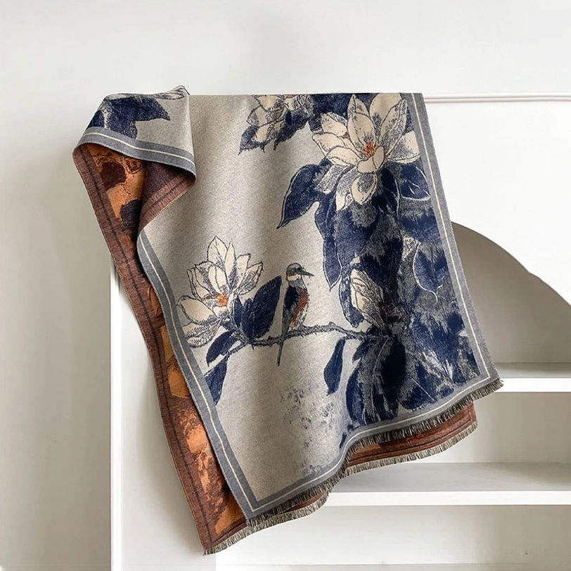 Steel blue Tibetan magnolia bird scarf displayed flat showing reversible design and contrast trim