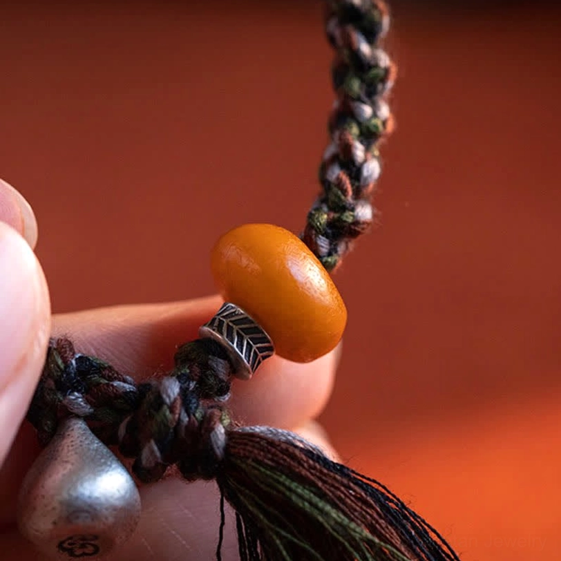 Multiple views of handmade Tibetan amber steelyard bracelet showing versatility in wearing and styling options